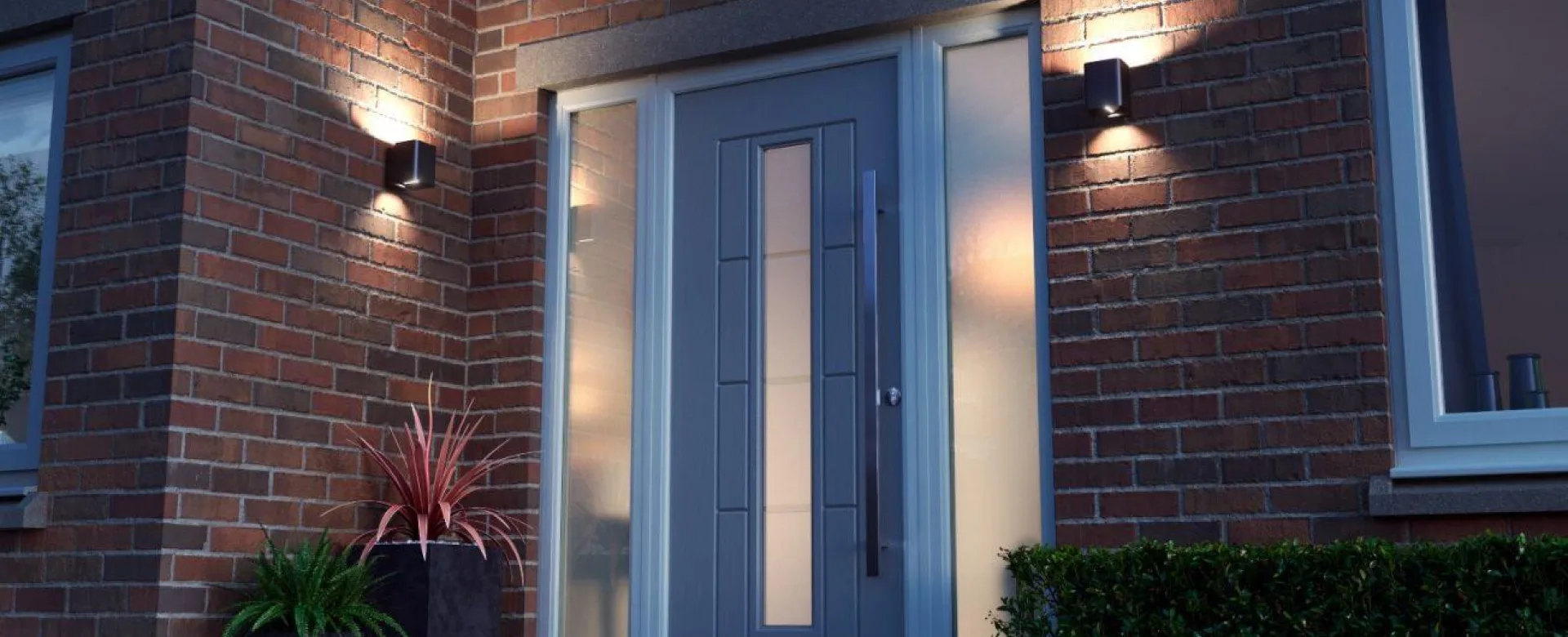 Composite front door lit at night