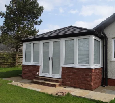 Conservatory with solid tiled roof