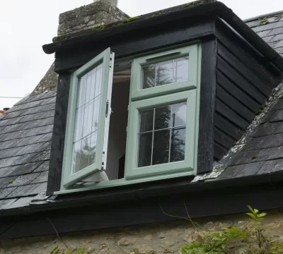 Green Georgian-bar windows on a period property
